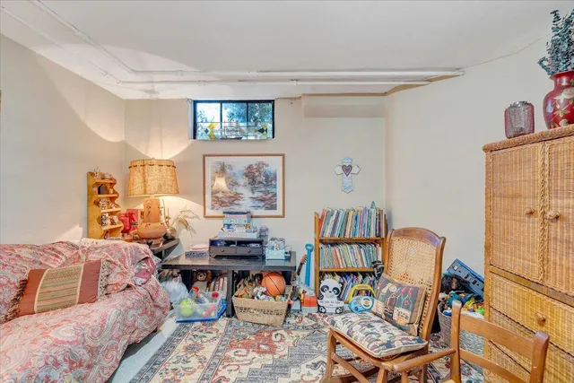 a bed room with a bed and a chandelier