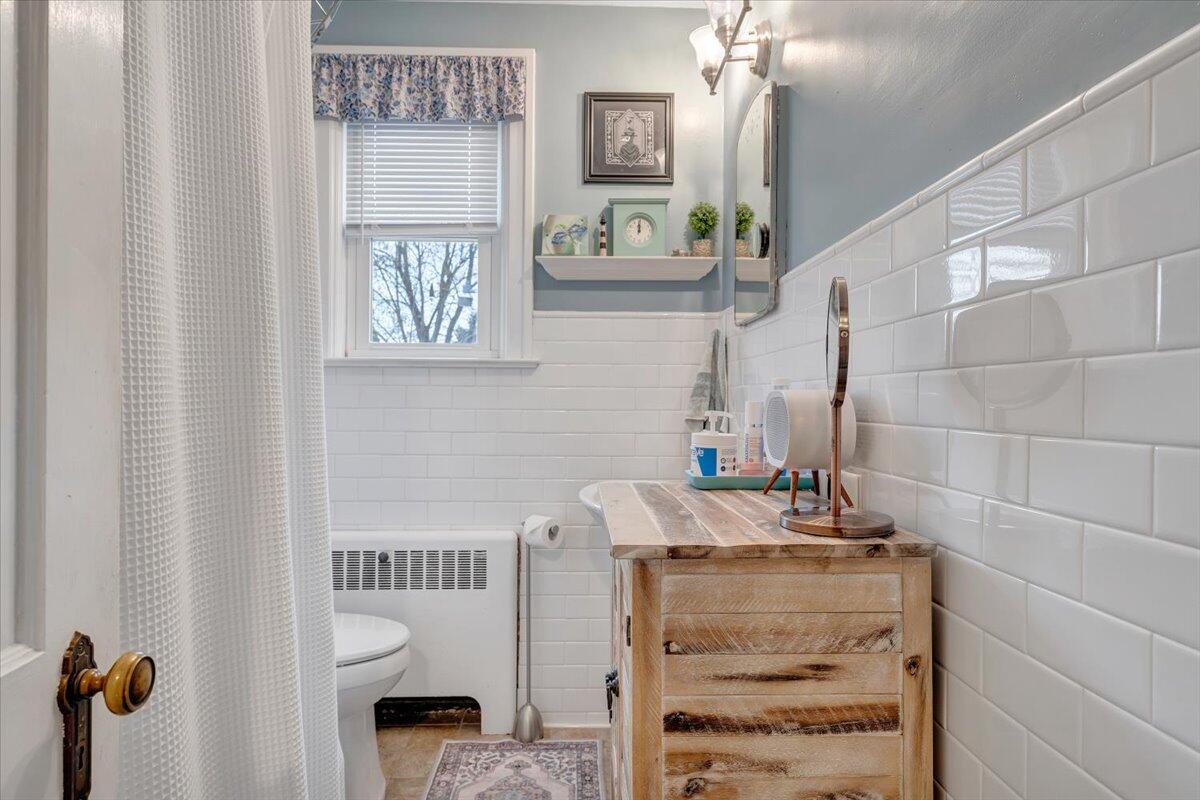 1909 Canterbury Road Southwest Roanoke, VA 24015 - Photo 24 of 65 a bathroom with a sink and a mirror