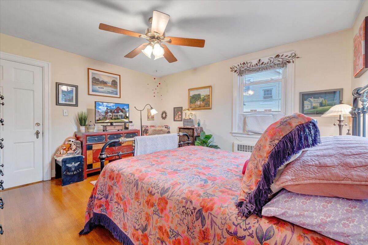 1909 Canterbury Road Southwest Roanoke, VA 24015 - Photo 27 of 65 a bed room with a bed and a chandelier