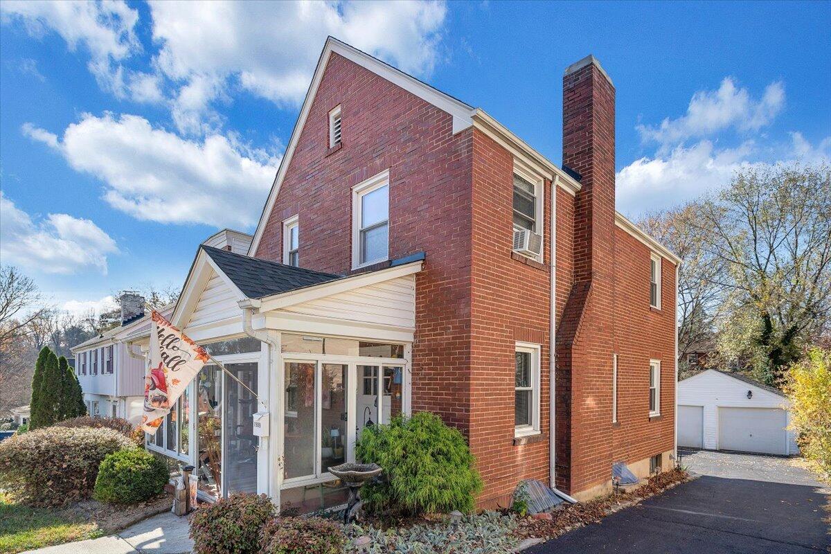 1909 Canterbury Road Southwest Roanoke, VA 24015 - Photo 3 of 65 a front view of a house with a yard