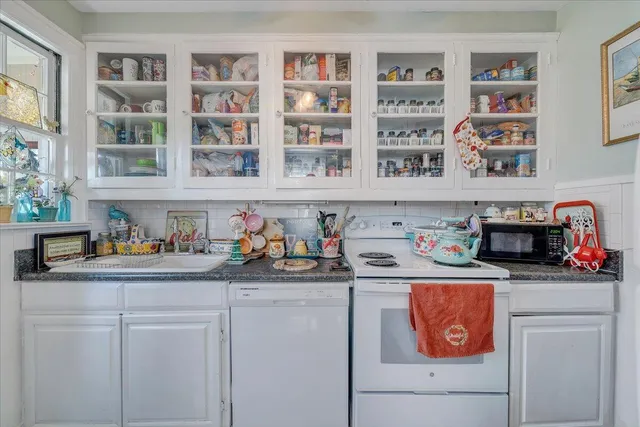 a front view of a house with a yard and porch