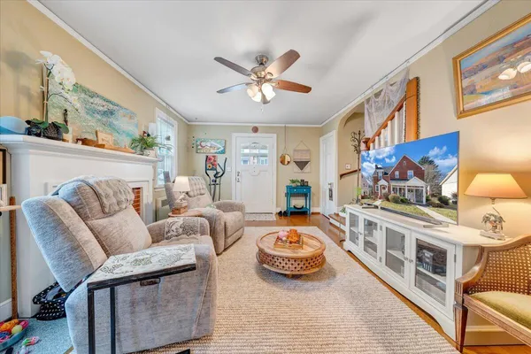 a living room with furniture and a fireplace