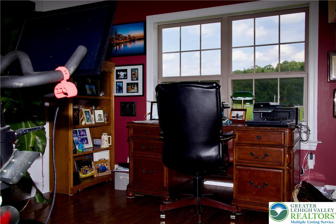 101 Cider Mill Road Mertztown, PA 19539 - Photo 9 of 26 a view of a workspace with furniture and a large window