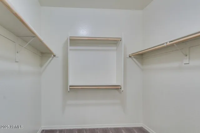 a view of an empty walk in closet