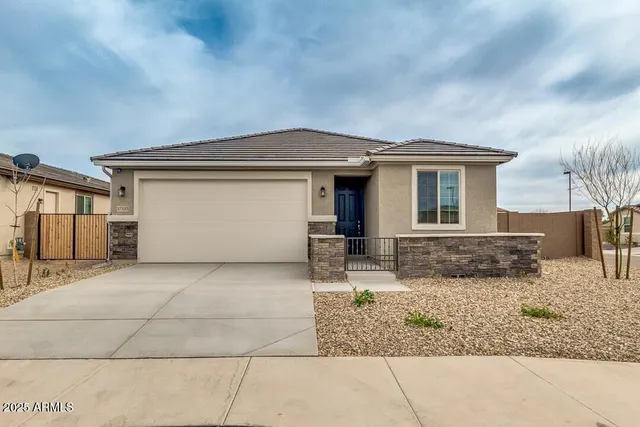 a front view of a house with natural light