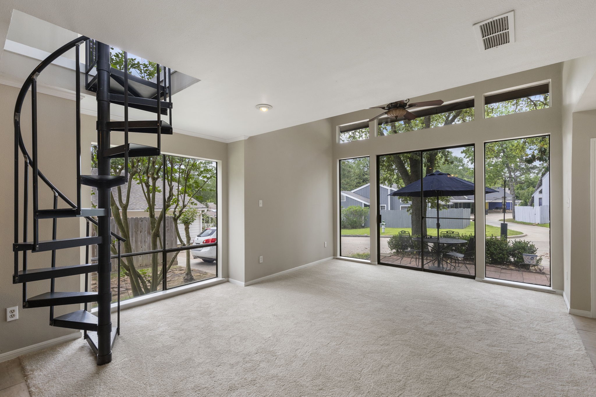 49 April Village Conroe, TX 77356 - Photo 7 of 46 a view of an outdoor space with windows and hardwood floor