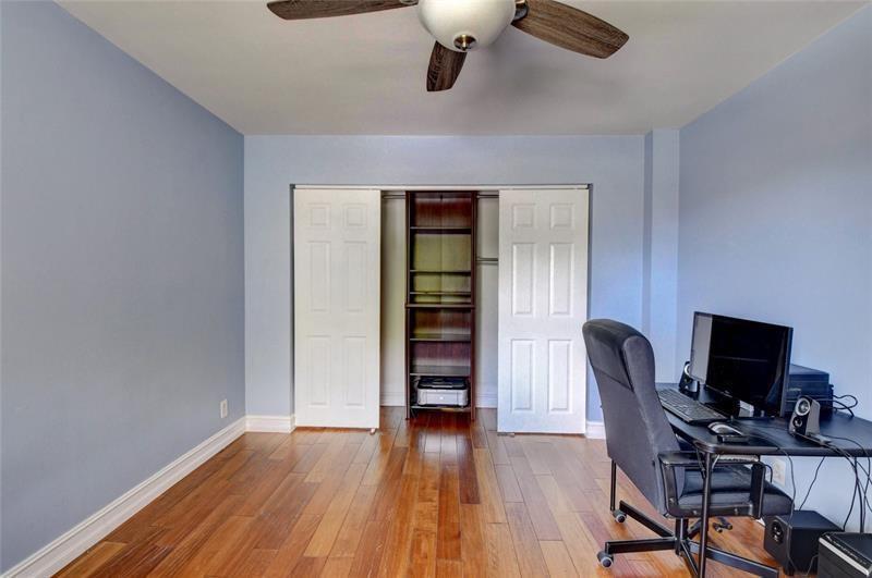 9316 Ketay Circle Boca Raton, FL 33428 - Photo 23 of 30 a view of a workspace with furniture and wooden floor