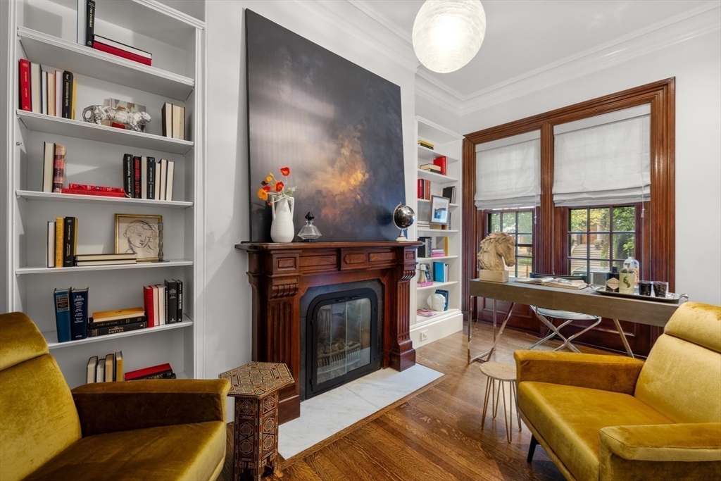 321 Beacon Street Boston, MA 02116 - Photo 13 of 34 a living room with furniture and a fireplace