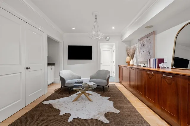 a view of a dining room with furniture and a rug