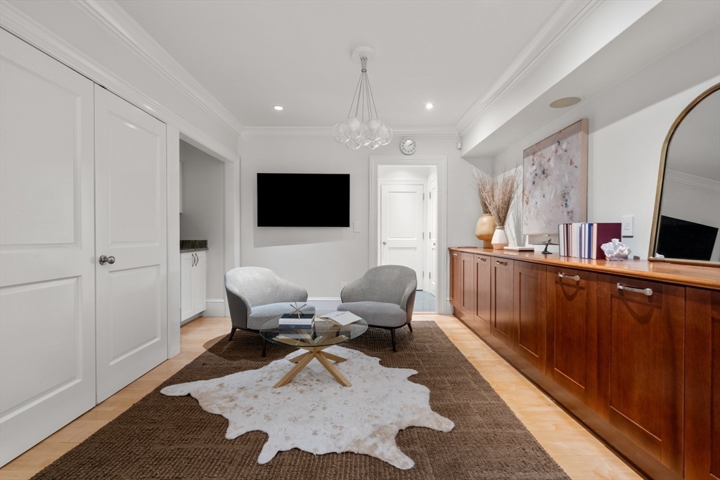 321 Beacon Street Boston, MA 02116 - Photo 15 of 34 a living room with furniture and a flat screen tv
