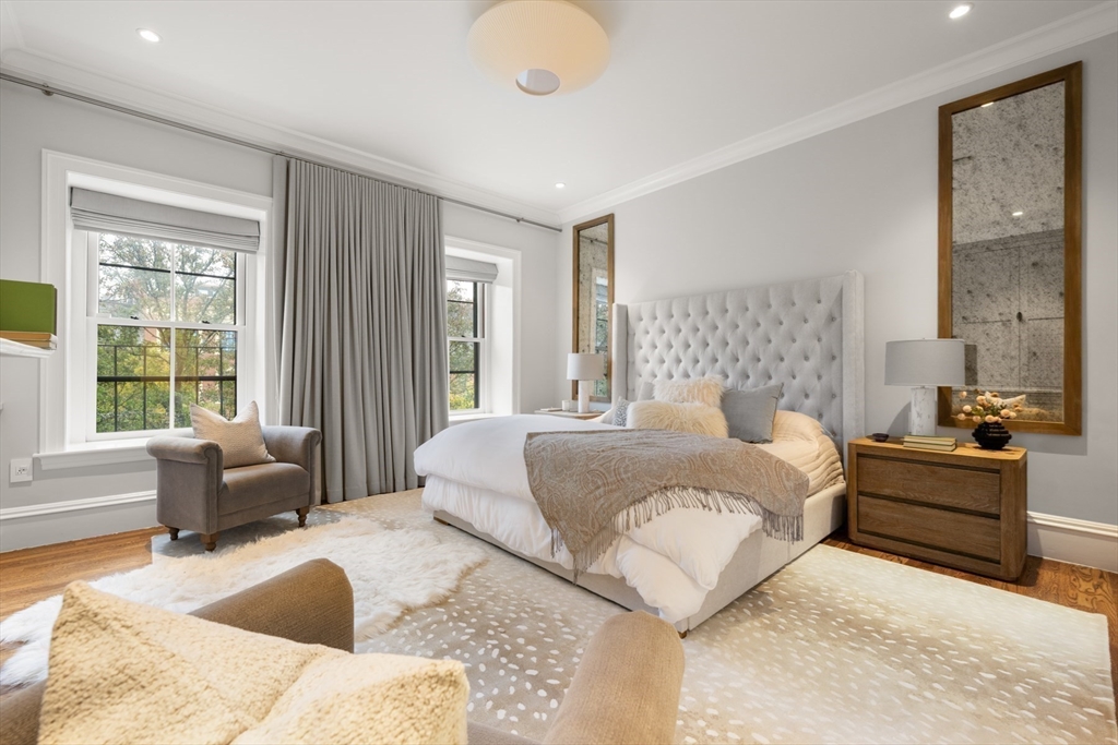 321 Beacon Street Boston, MA 02116 - Photo 21 of 34 a bedroom with a large bed couch and windows