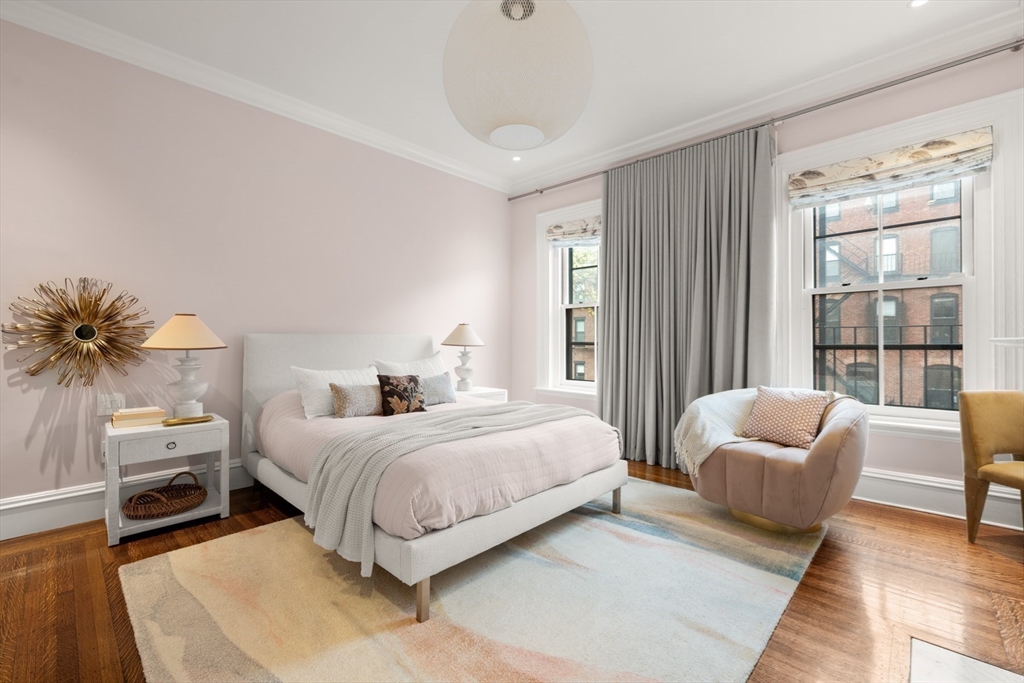 321 Beacon Street Boston, MA 02116 - Photo 24 of 34 a bedroom with a bed and a couch