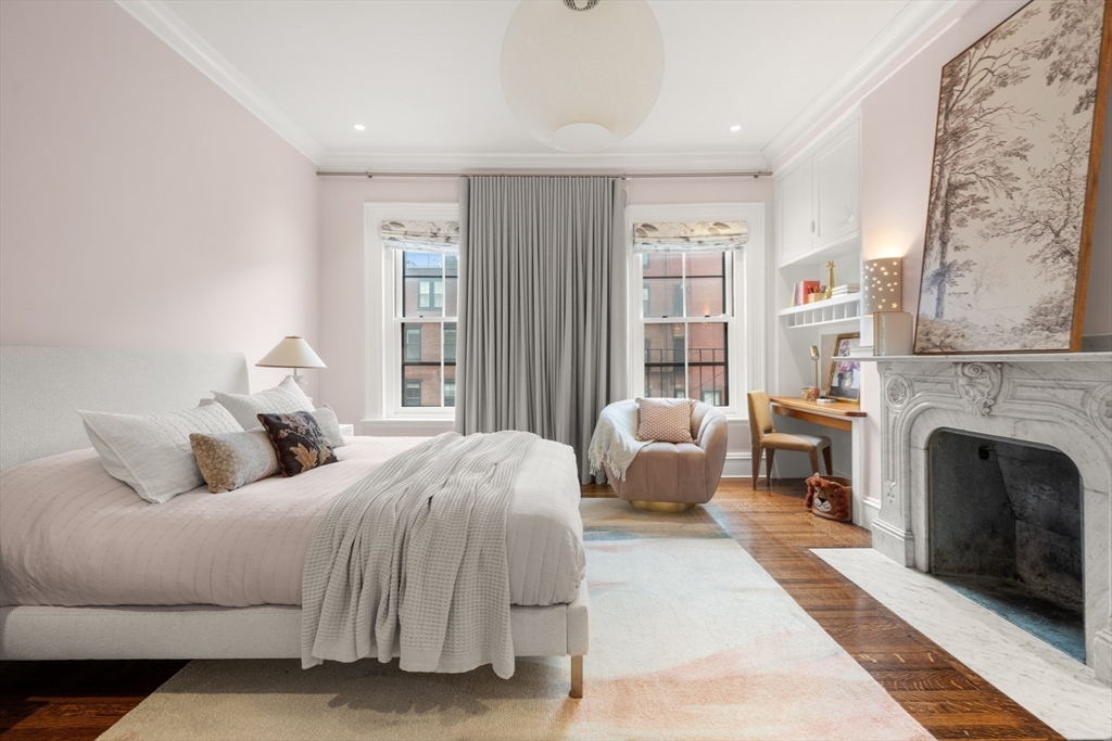 321 Beacon Street Boston, MA 02116 - Photo 25 of 34 a bedroom with bed and a fireplace