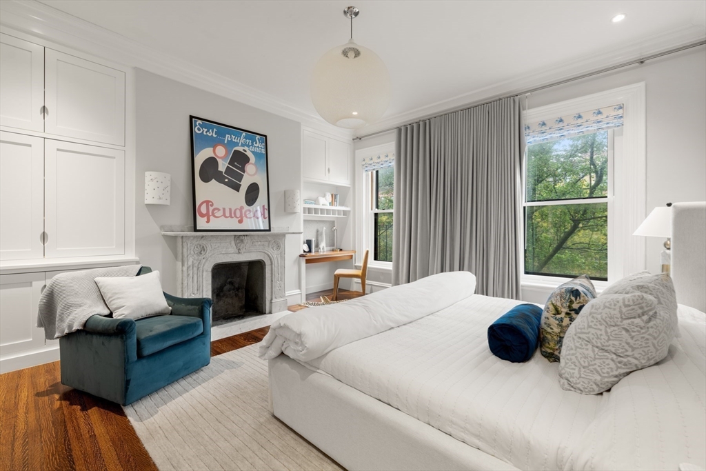 321 Beacon Street Boston, MA 02116 - Photo 28 of 34 a bedroom with a bed and a fireplace