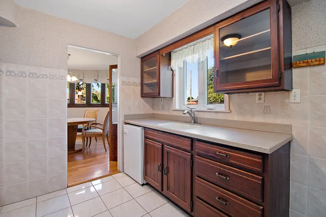 a bathroom with a sink a vanity and a mirror