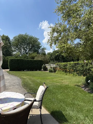 a view of a two chairs in a yard
