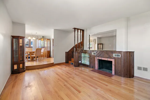 a view of a livingroom with furniture and a fireplace