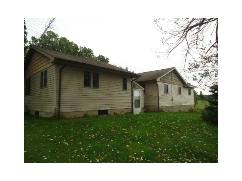 992 Sterrett Road Grove City, PA 16127 - Photo 20 of 25 Exterior Back. The door in the back is the outdoor entrance to the basement.
