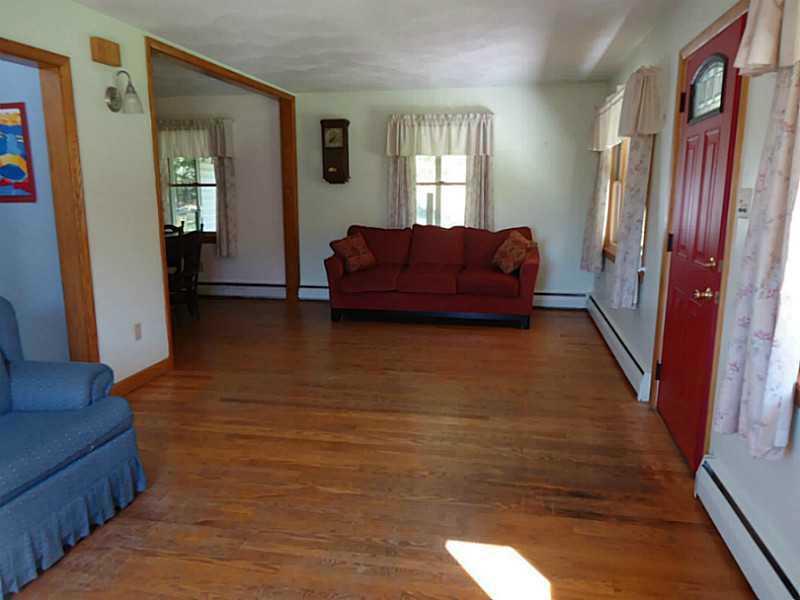 992 Sterrett Road Grove City, PA 16127 - Photo 4 of 25 Living Room. Hardwood floors throughout and new windows and front door in the spacious living room.
