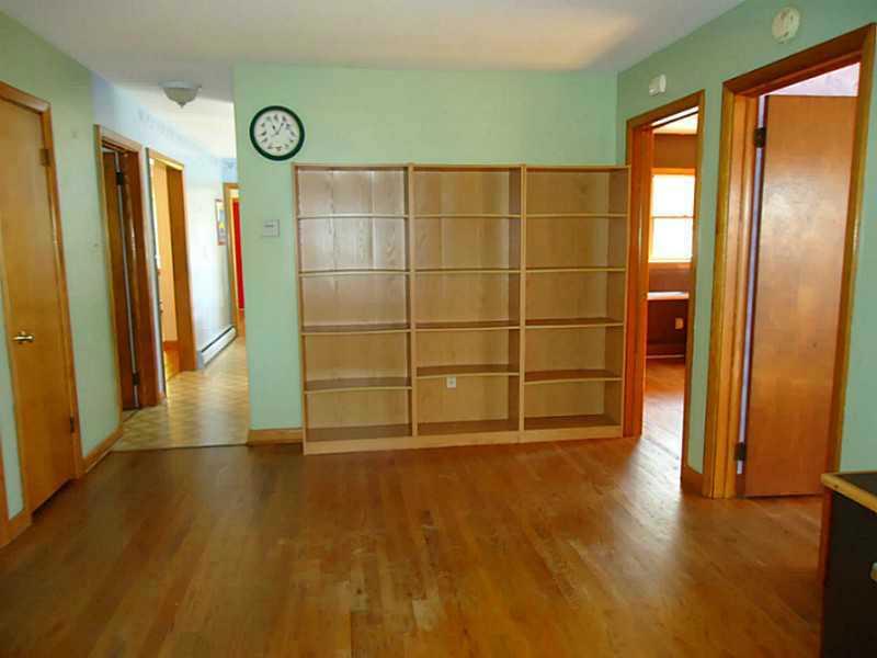 992 Sterrett Road Grove City, PA 16127 - Photo 8 of 25 Den. The den has a built in bookcase and separates three of the bedrooms. There is a computer desk included.