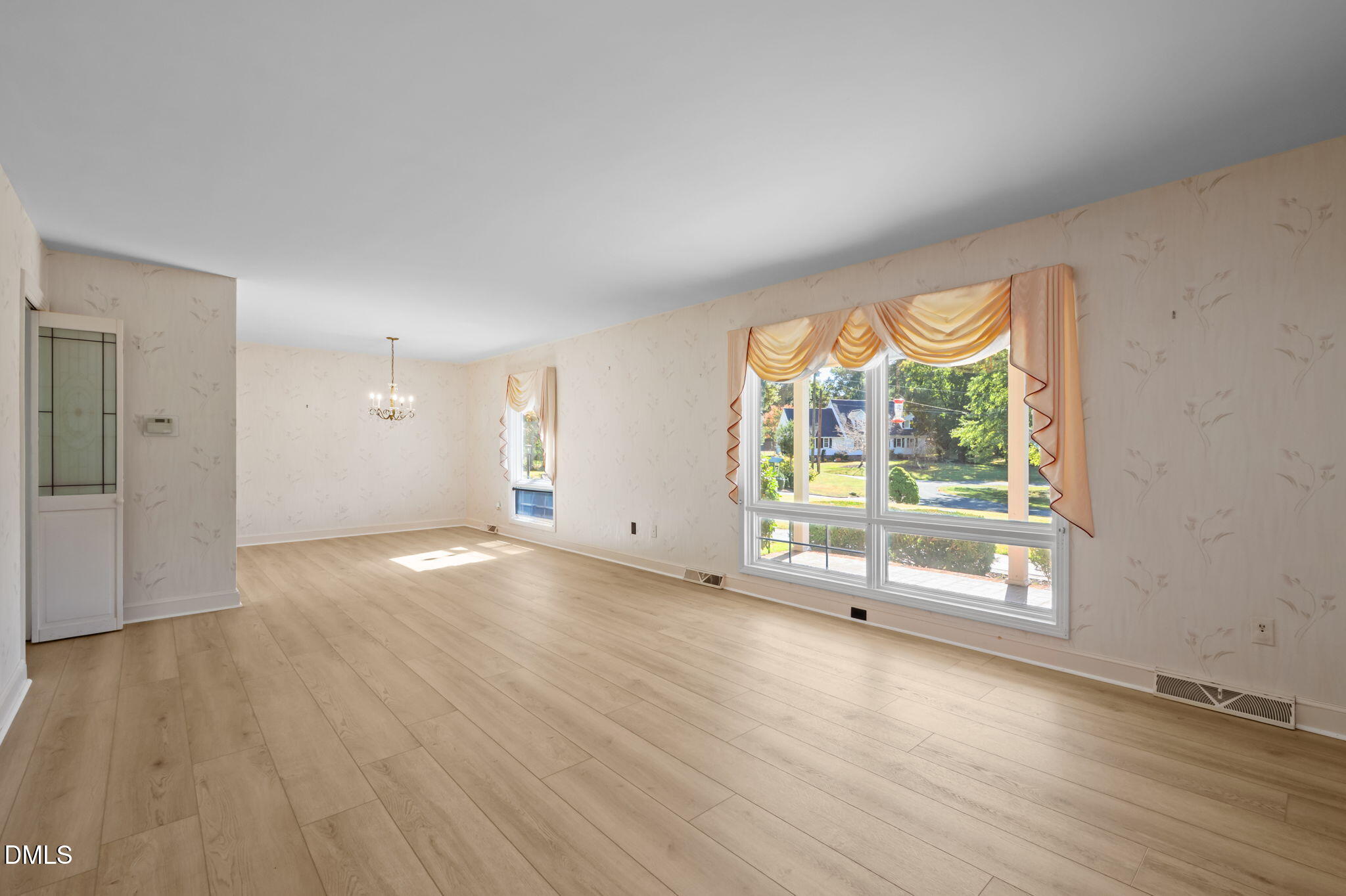 60 Banbury Court Roxboro, NC 27573 - Photo 24 of 59 an empty room with wooden floor and windows
