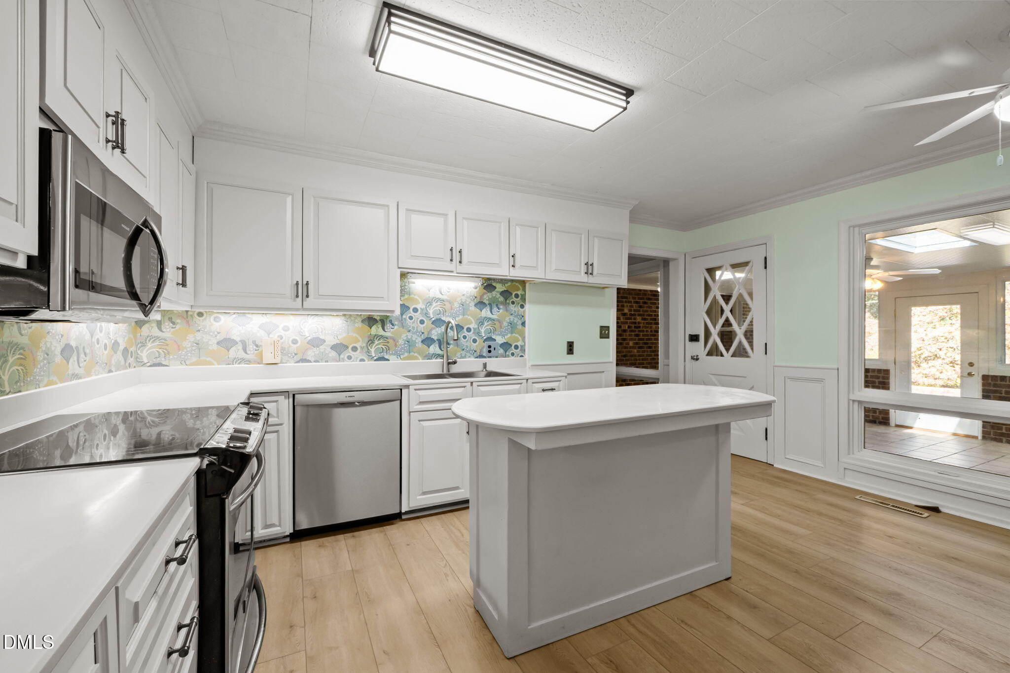 60 Banbury Court Roxboro, NC 27573 - Photo 28 of 59 a kitchen with granite countertop a sink stove and cabinets