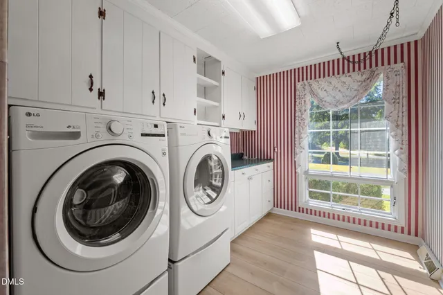 a kitchen with a sink a stove and a refrigerator