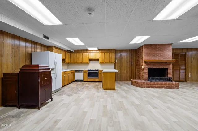 a view of kitchen with furniture and a fireplace