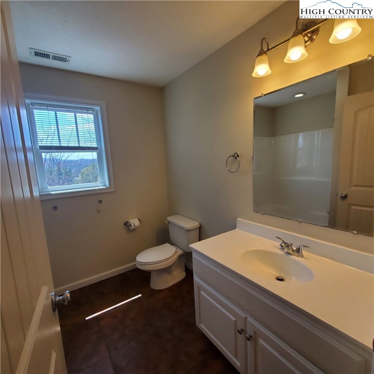 161 Alexander Drive Boone, NC 28607 - Photo 16 of 28 a bathroom with a sink toilet and shower