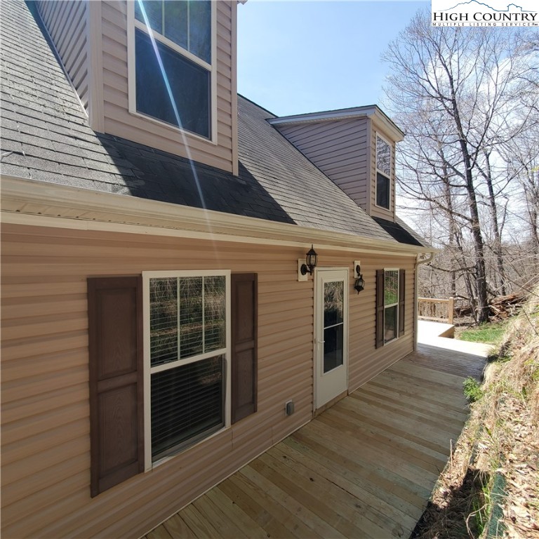 161 Alexander Drive Boone, NC 28607 - Photo 26 of 28 a view of a house with a door and wooden walls