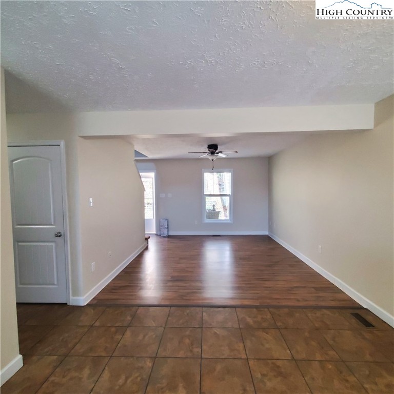 161 Alexander Drive Boone, NC 28607 - Photo 9 of 28 a view of a livingroom with wooden floor and window