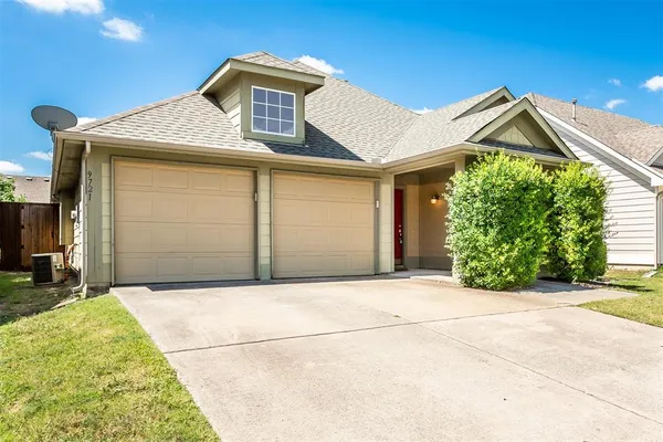 a front view of a house with a garage