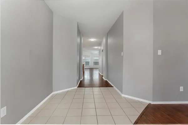 a view of an empty room and a window