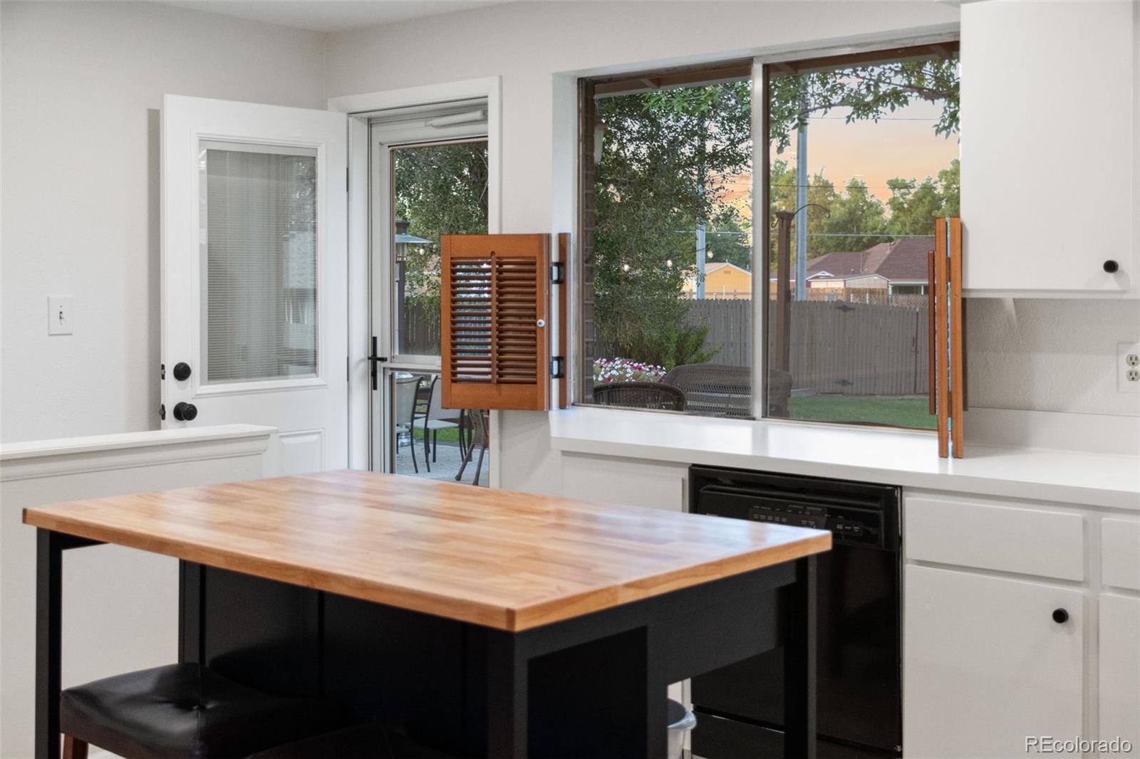 5366 Field Circle Arvada, CO 80002 - Photo 11 of 50 a room with a table chairs and wooden floor