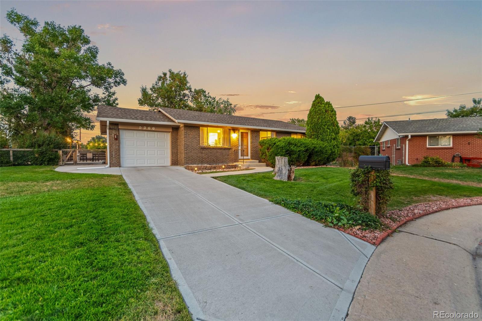 5366 Field Circle Arvada, CO 80002 - Photo 2 of 50 a front view of house with yard and green space