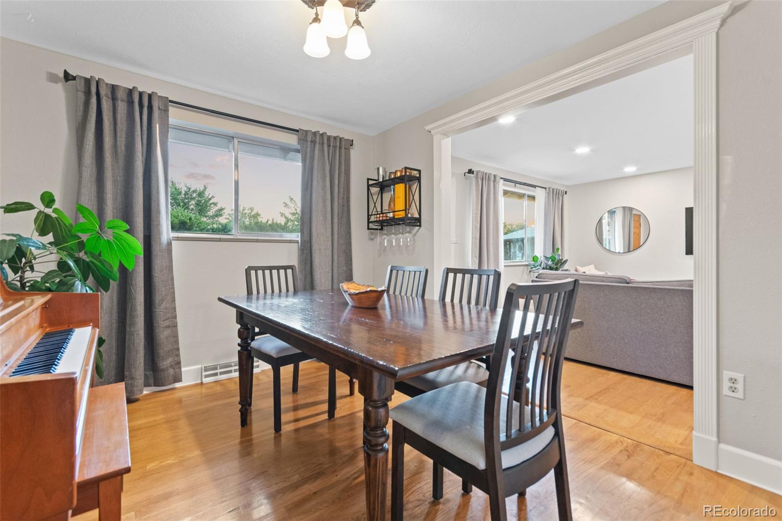 5366 Field Circle Arvada, CO 80002 - Photo 21 of 50 a view of a dining room with furniture window and wooden floor