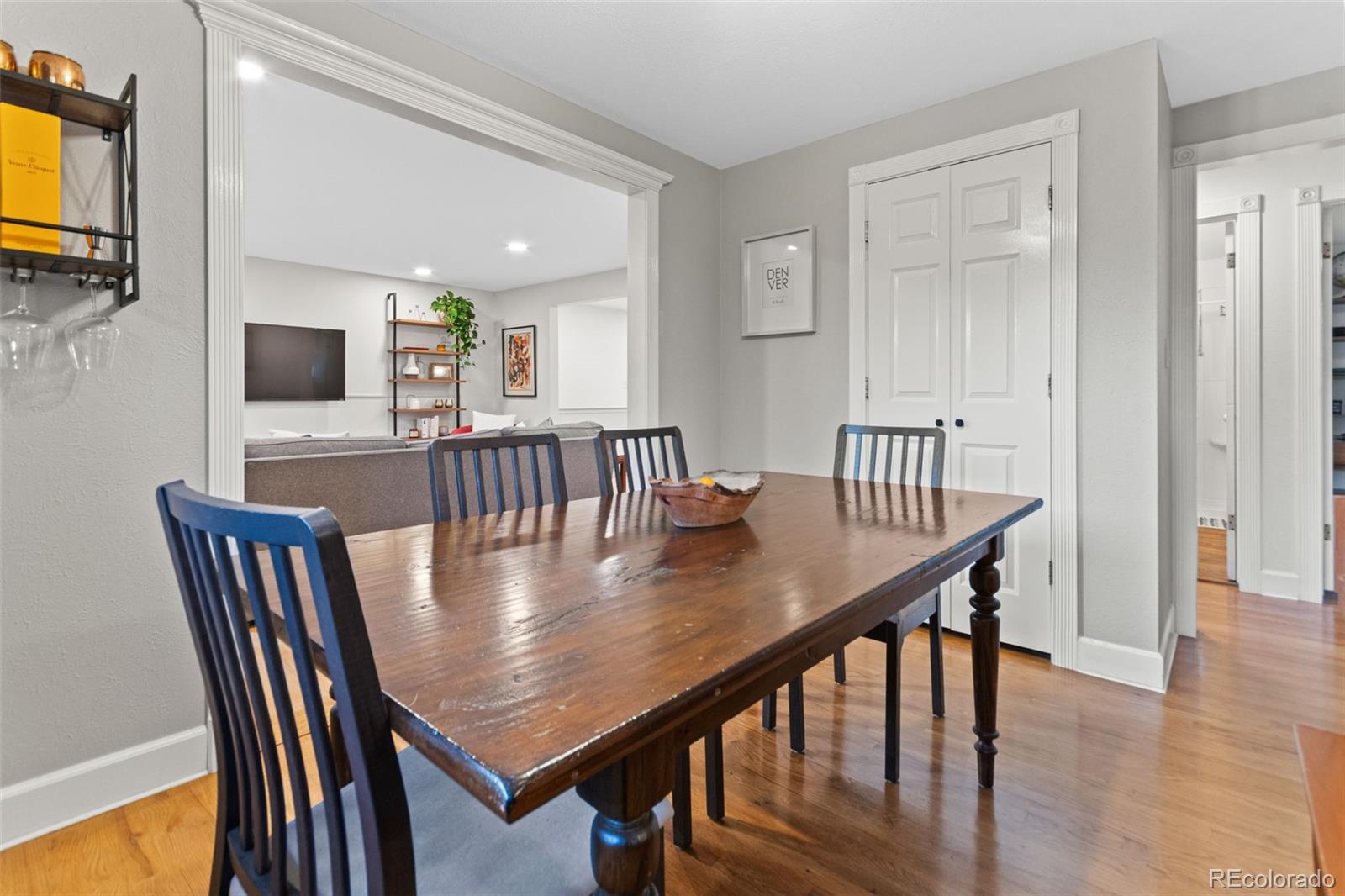 5366 Field Circle Arvada, CO 80002 - Photo 22 of 50 a view of a dining room with furniture and wooden floor