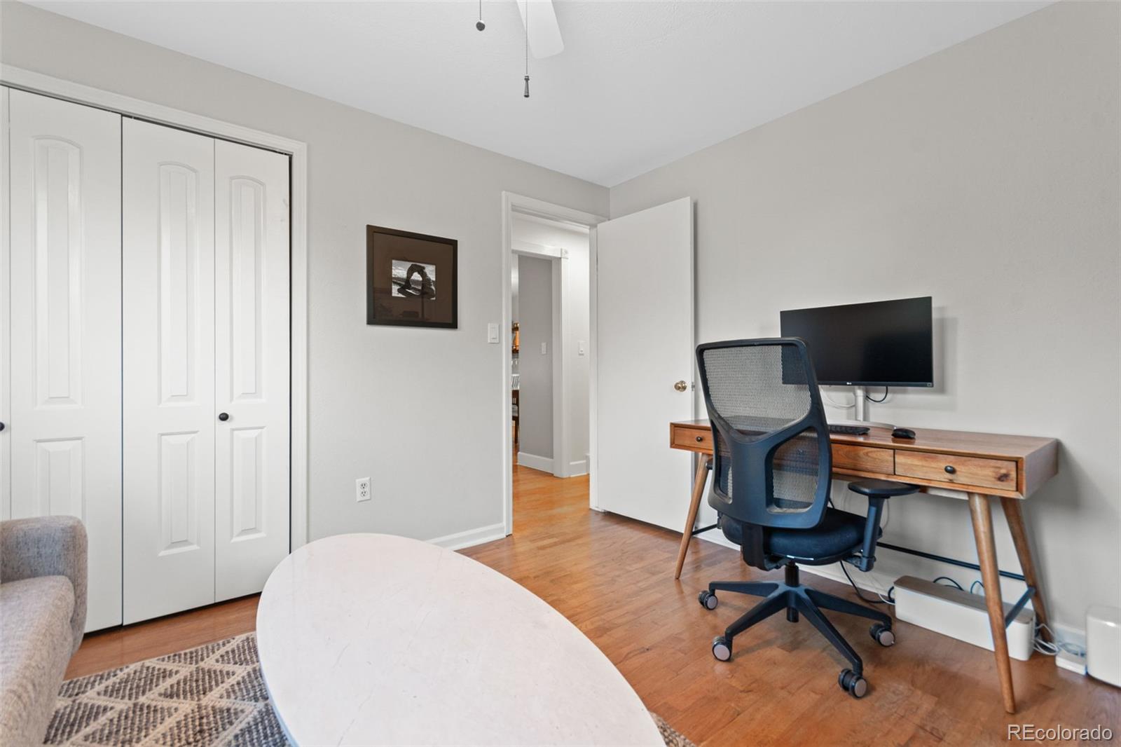 5366 Field Circle Arvada, CO 80002 - Photo 29 of 50 a view of a livingroom with workspace and a couch