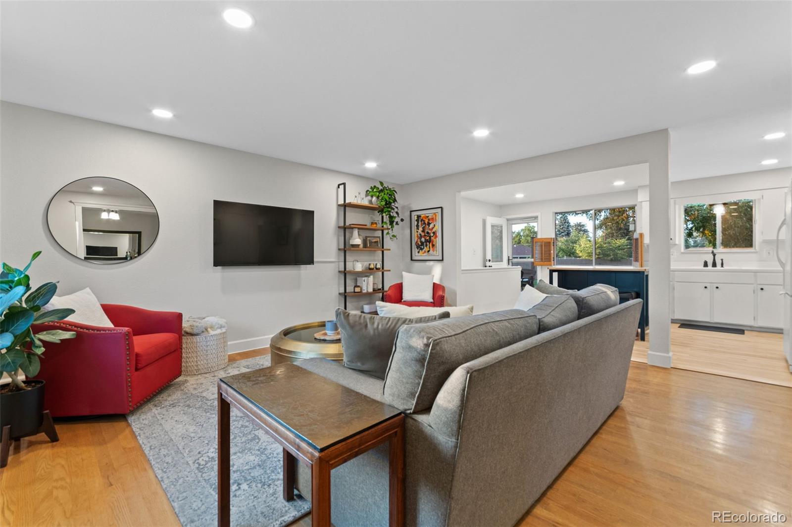 5366 Field Circle Arvada, CO 80002 - Photo 3 of 50 a living room with furniture and a flat screen tv