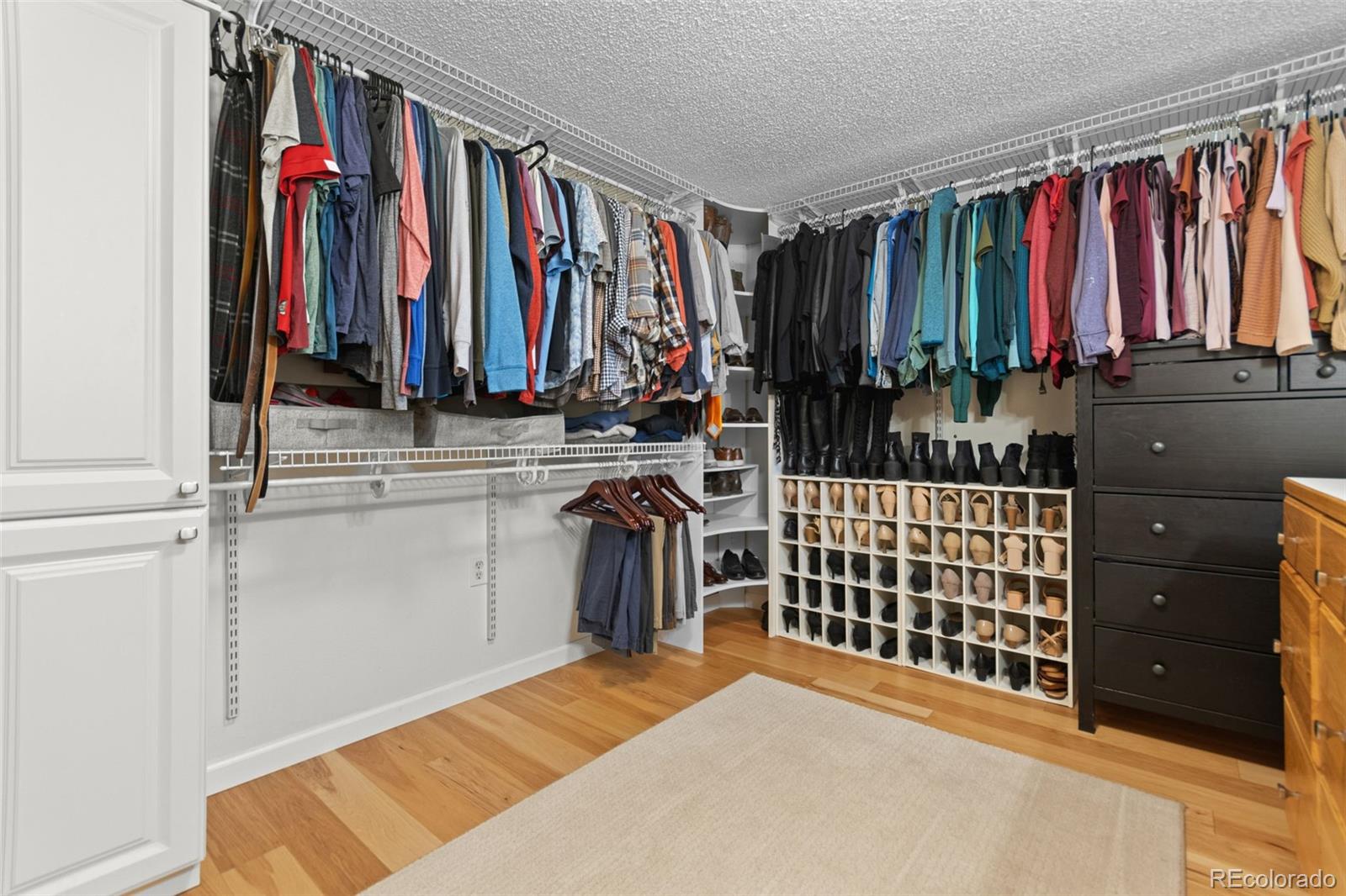 5366 Field Circle Arvada, CO 80002 - Photo 35 of 50 a view of a bedroom with clothes and shoes