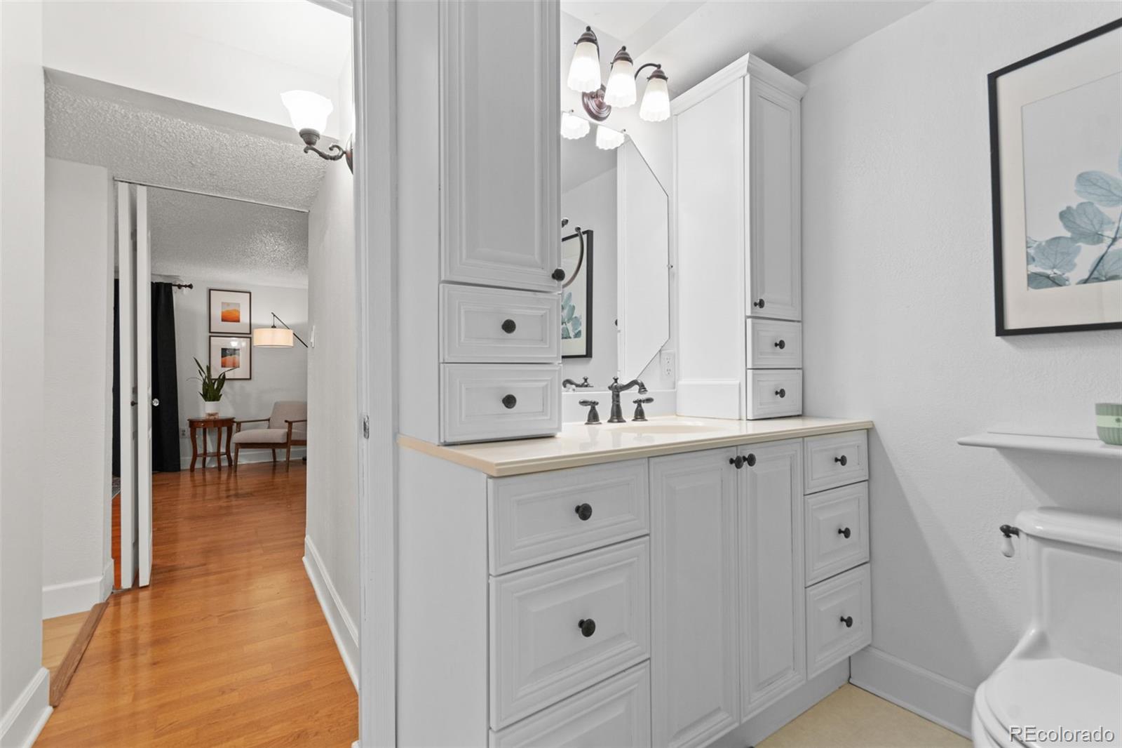 5366 Field Circle Arvada, CO 80002 - Photo 37 of 50 a spacious bathroom with a double vanity sink a mirror and a shower