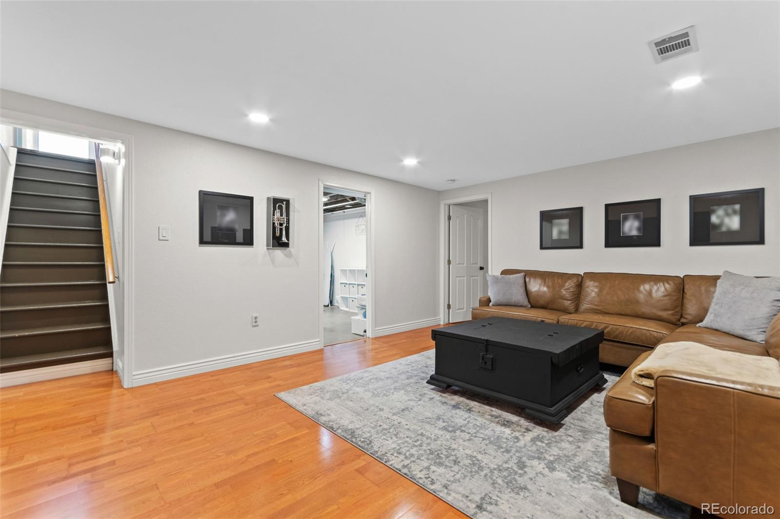 5366 Field Circle Arvada, CO 80002 - Photo 39 of 50 a living room with furniture and a flat screen tv