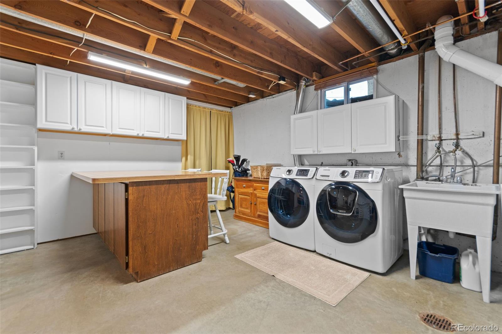 5366 Field Circle Arvada, CO 80002 - Photo 40 of 50 a utility room with dryer and washer