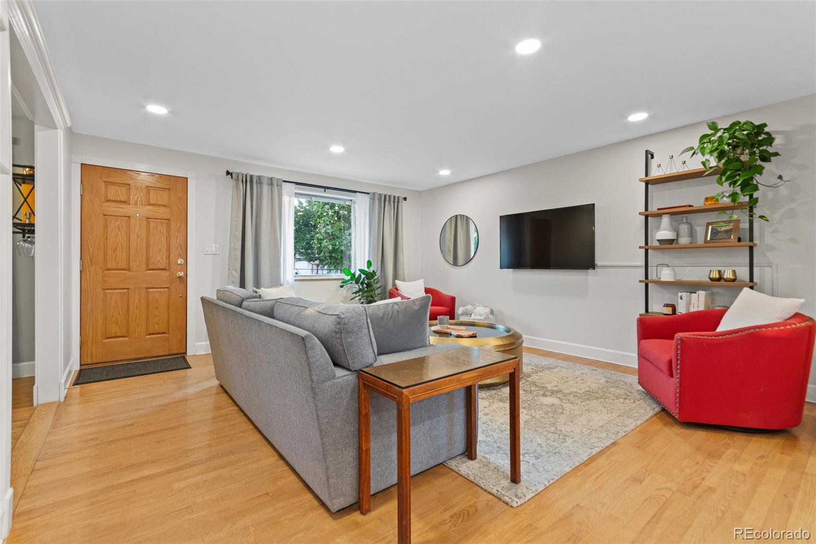5366 Field Circle Arvada, CO 80002 - Photo 4 of 50 a living room with furniture and a flat screen tv