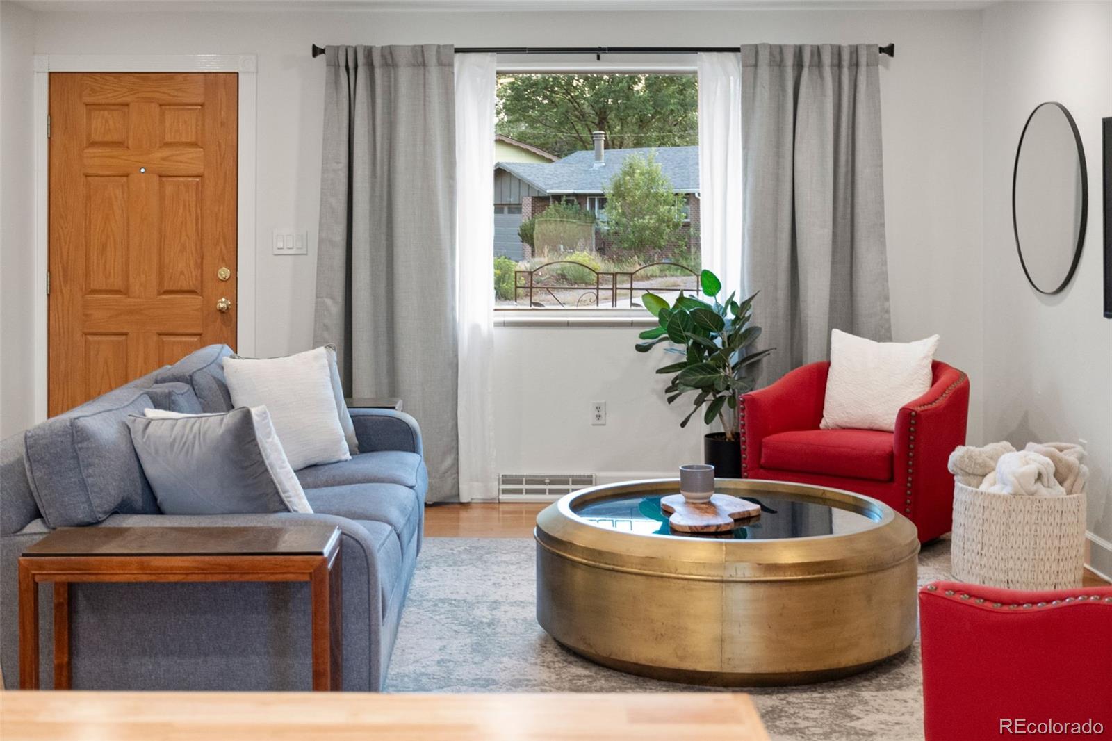 5366 Field Circle Arvada, CO 80002 - Photo 5 of 50 a living room with furniture and a potted plant