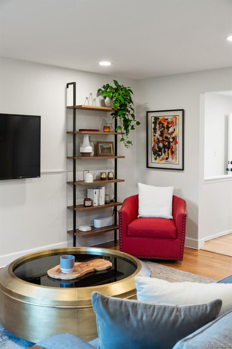 5366 Field Circle Arvada, CO 80002 - Photo 6 of 50 a living room with furniture and a flat screen tv