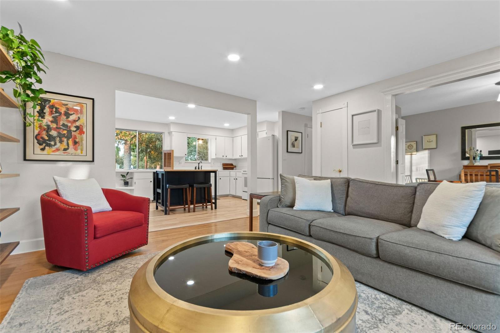5366 Field Circle Arvada, CO 80002 - Photo 7 of 50 a living room with furniture a rug and a fireplace