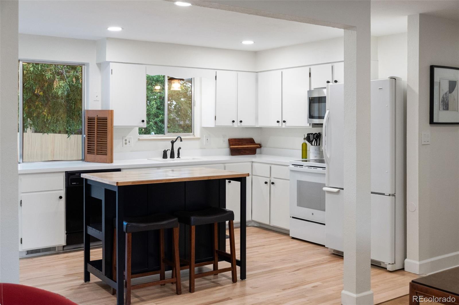 5366 Field Circle Arvada, CO 80002 - Photo 10 of 50 a kitchen with a sink stove and cabinets