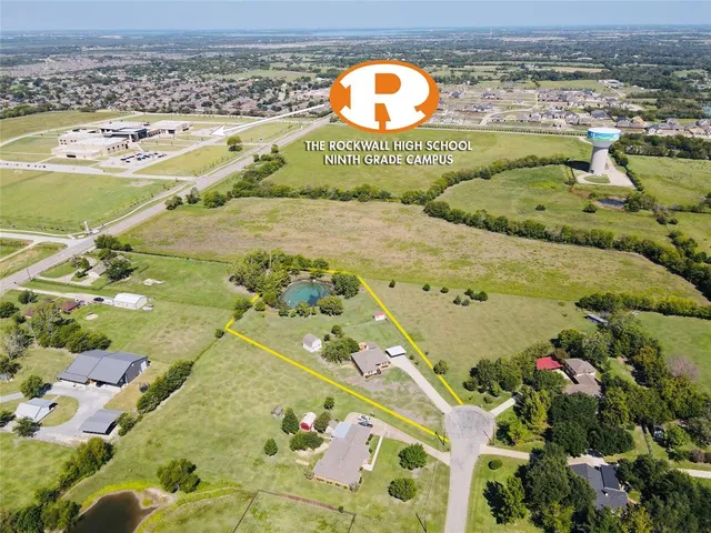 a view of swimming pool with a lot of flowers in it