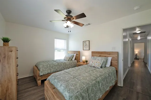 a kitchen with a sink appliances and cabinets